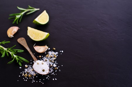 Large crystals of salt with spices on a dark background. Selective focus.の写真素材