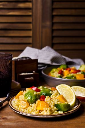 Pasta with vegetables on a wooden background. Selective focus.の写真素材