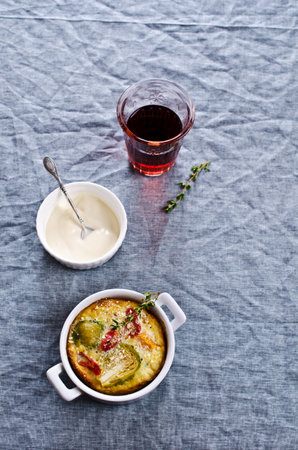 Casserole with vegetables on a textile background. Selective focus.