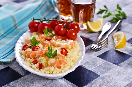Couscous with shrimp and vegetables. Selective focus.の写真素材