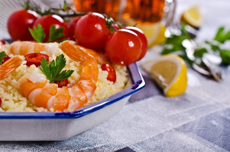 Couscous with shrimp and vegetables. Selective focus.の写真素材