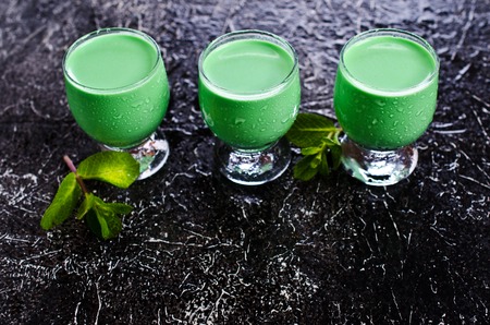 Green creamy liquid in a glass. Selective focus.の写真素材