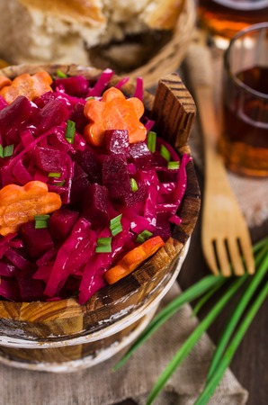 Homemade pickled vegetables on a wooden background. Selective focus.の写真素材