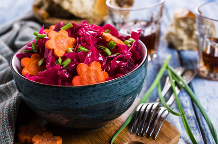 Homemade pickled vegetables on a wooden background. Selective focus.