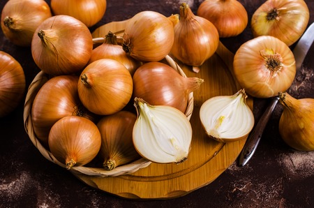 Fresh  bulb onions on the table. Selective focus.の写真素材