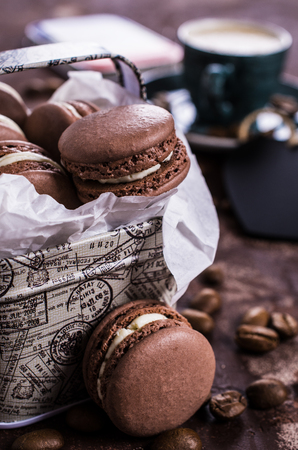 Macaroon with white cream on a dark background. Selective focus.の写真素材