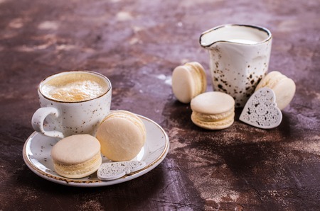 Macaroon with white cream on a dark background. Selective focus.の写真素材