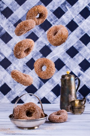 Donuts with sugar and cinnamon in the fall. Selective focus.の写真素材