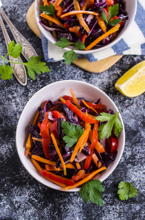 Salad of raw vegetables on a concrete background. Selective focus.の写真素材
