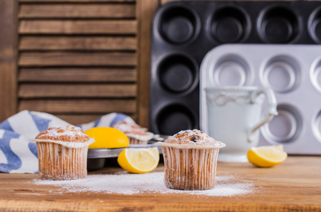 Muffins with raisins and powdered sugar. Selective focus.の写真素材