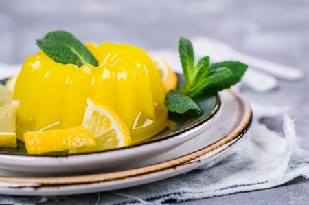 Traditional panna cotta with lemon and mint. Selective focus.の写真素材