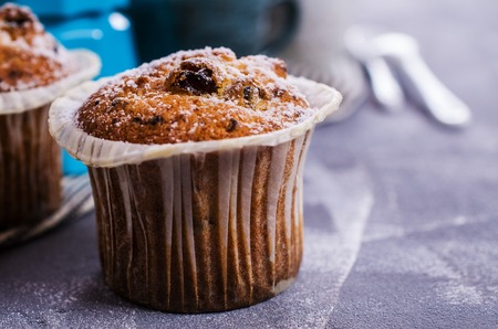 Muffin with raisins and powdered sugar. Selective focus.の写真素材