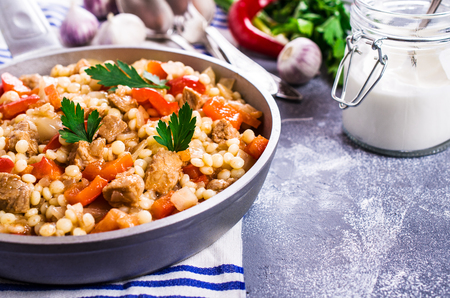 Small pasta with stewed vegetables and meat. Selective focus.の写真素材