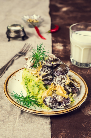 Stewed mushrooms in white sauce and mashed potatoes. Selective focus.の写真素材