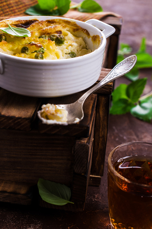 Casserole with pasta and peas in a serving bowl. Selective focus.の写真素材