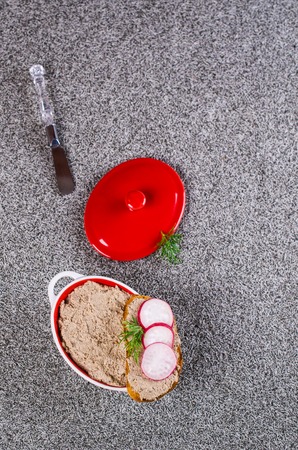 Toast with liver pate and radish on a dark background. Selective focus.の写真素材