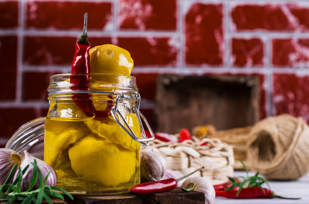 Marinated yellow pattypan with spices in oil on a wooden background. Selective focus.の写真素材