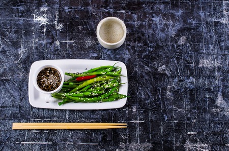 Green asparagus beans with sesame seeds. Selective focus.の写真素材