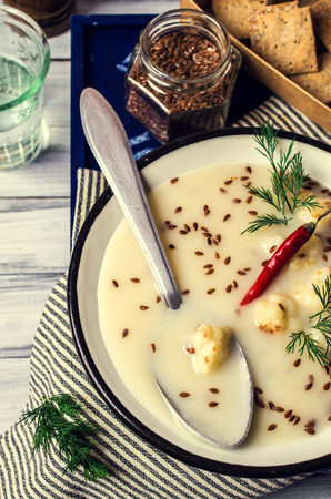 Creamy cauliflower soup with flax seeds. Selective focus.の写真素材
