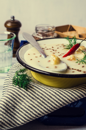 Creamy cauliflower soup with flax seeds. Selective focus.の写真素材