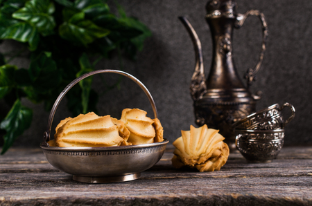 Traditional shortbread cookies with caramel filling on a wooden background. Selective focus.の写真素材
