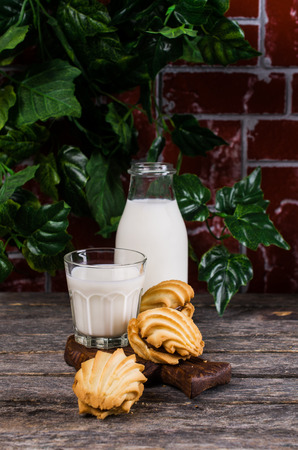 Traditional shortbread cookies with caramel filling on a wooden background. Selective focus.の写真素材