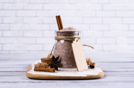 Dark sugar with cinnamon and anise on a wooden background. Selective focus.の写真素材