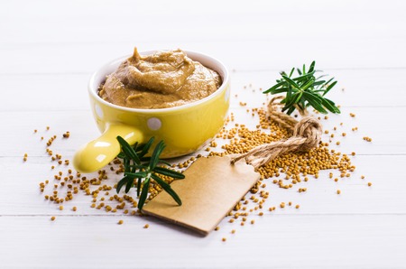Homemade spicy mustard sauce wooden background. Selective focus.の写真素材