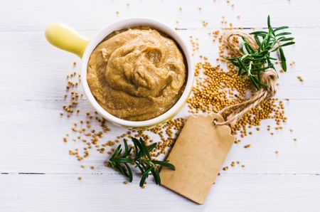 Homemade spicy mustard sauce wooden background. Selective focus.の写真素材
