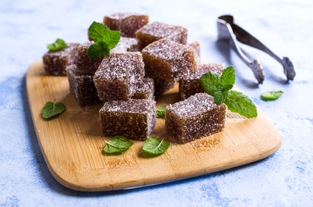 Homemade fruit marmalade in sugar with mint. Selective focus.の写真素材
