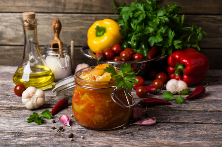 Pickled peppers in tomato sauce with spices. Selective focus.の写真素材