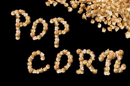 Popcorn with caramel taste on a white background. Selective focus.の写真素材