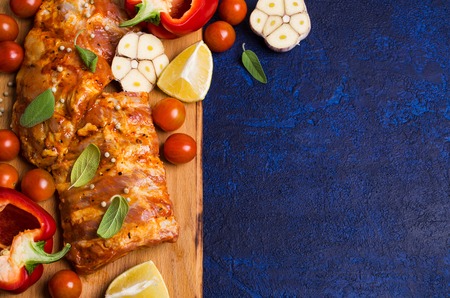 Raw ribs in marinade with vegetables and spices. Selective focus.の写真素材