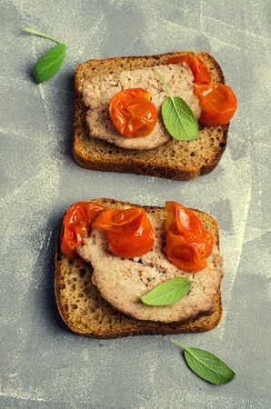 Traditional meatloaf with spices and vegetables on the table. Selective focus.の写真素材