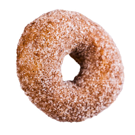 One traditional donut in sugar on a white background. Selective focus.の写真素材
