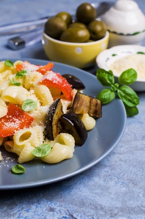 Traditional Italian pasta with vegetables and cheese in a bowl. Selective focus.の写真素材