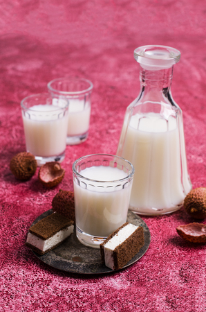 White alcoholic drink in glass on the table. Selective focus.の写真素材