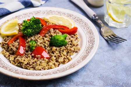 Cooked multi colored quinoa with vegetables and lemon. Selective focus.の写真素材