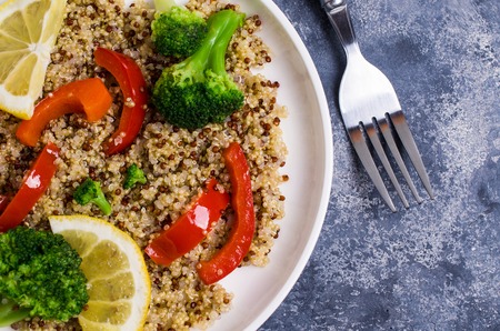 Cooked multi colored quinoa with vegetables and lemon. Selective focus.の写真素材