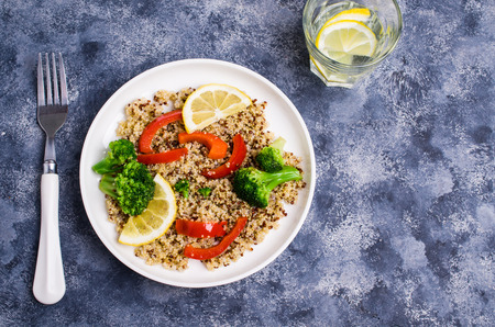 Cooked multi colored quinoa with vegetables and lemon. Selective focus.の写真素材