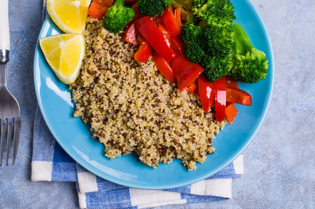 Cooked multi colored quinoa with vegetables and lemon. Selective focus.の写真素材