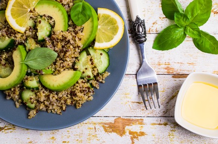 Quinoa salad with vegetables in a bowl on the table. Selective focus.の写真素材