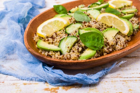 Quinoa salad with vegetables in a bowl on the table. Selective focus.の写真素材