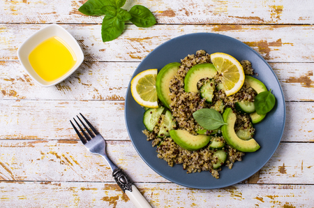 Quinoa salad with vegetables in a bowl on the table. Selective focus.の写真素材