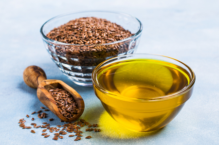 Traditional transparent flax oil in the dining room dishes on the table. Selective focus.の写真素材