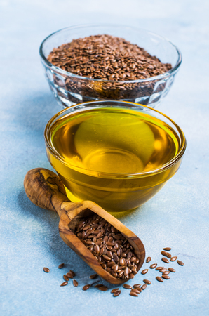 Traditional transparent flax oil in the dining room dishes on the table. Selective focus.の写真素材