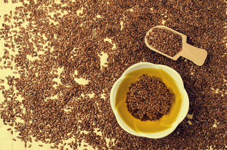 Traditional transparent flax oil in the dining room dishes on the table. Selective focus.の写真素材