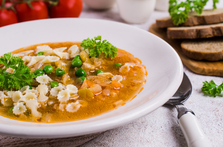 Thick traditional Italian soup with pasta and vegetables. Selective focus.の写真素材