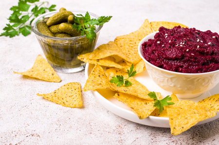 Traditional beet dip with sesame seeds in a dish on the table. Selective focus.