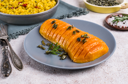 Roasted Butternut squash with spicy rice in a dish on the table. Selective focus.の写真素材
